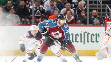 DENVER, CO - APRIL 2: Colin Wilson #22 of the Colorado Avalanche skates against Connor McDavid #97 of the Edmonton Oilers at the Pepsi Center on April 2, 2019 in Denver, Colorado. (Photo by Michael Martin/NHLI via Getty Images)