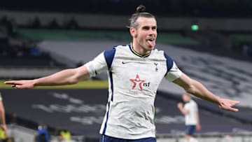 Tottenham Hotspur's Welsh midfielder Gareth Bale celebrates scoring his team's third goal and his hatrick goal during the English Premier League football match between Tottenham Hotspur and Sheffield United at Tottenham Hotspur Stadium in London, on May 2, 2021. - - RESTRICTED TO EDITORIAL USE. No use with unauthorized audio, video, data, fixture lists, club/league logos or 'live' services. Online in-match use limited to 120 images. An additional 40 images may be used in extra time. No video emulation. Social media in-match use limited to 120 images. An additional 40 images may be used in extra time. No use in betting publications, games or single club/league/player publications. (Photo by Shaun Botterill / POOL / AFP) / RESTRICTED TO EDITORIAL USE. No use with unauthorized audio, video, data, fixture lists, club/league logos or 'live' services. Online in-match use limited to 120 images. An additional 40 images may be used in extra time. No video emulation. Social media in-match use limited to 120 images. An additional 40 images may be used in extra time. No use in betting publications, games or single club/league/player publications. / RESTRICTED TO EDITORIAL USE. No use with unauthorized audio, video, data, fixture lists, club/league logos or 'live' services. Online in-match use limited to 120 images. An additional 40 images may be used in extra time. No video emulation. Social media in-match use limited to 120 images. An additional 40 images may be used in extra time. No use in betting publications, games or single club/league/player publications. (Photo by SHAUN BOTTERILL/POOL/AFP via Getty Images)