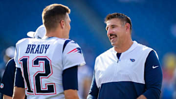 NASHVILLE, TN - AUGUST 17: Tom Brady #12 of the New England Patriots talks with Head Coach Mike Vrabel of the Tennessee Titans before the game during week two of the preseason at Nissan Stadium on August 17, 2019 in Nashville, Tennessee. The Patriots defeated the Titans 22-17. (Photo by Wesley Hitt/Getty Images)