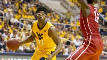 Feb 20, 2016; Morgantown, WV, USA; West Virginia Mountaineers forward Devin Williams (41) dribbles the ball during the second half against the Oklahoma Sooners at the WVU Coliseum. Mandatory Credit: Ben Queen-USA TODAY Sports