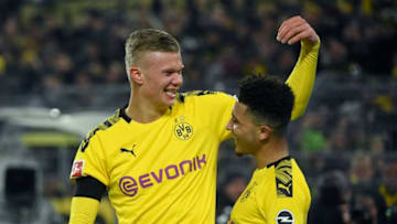 Dortmund's Norwegian forward Erling Braut Haaland celebrate scoring the 4-1 goal with Dortmund's English midfielder Jadon Sancho during the German first division Bundesliga football match Borussia Dortmund v FC Cologne in Dortmund, on January 24, 2020. (Photo by Ina FASSBENDER / AFP) / DFL REGULATIONS PROHIBIT ANY USE OF PHOTOGRAPHS AS IMAGE SEQUENCES AND/OR QUASI-VIDEO (Photo by INA FASSBENDER/AFP via Getty Images)