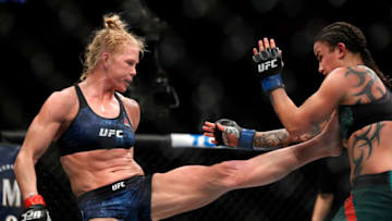 LAS VEGAS, NEVADA - JANUARY 18: Holly Holm (L) kicks Raquel Pennington in bantamweight bout during UFC 246 at T-Mobile Arena on January 18, 2020 in Las Vegas, Nevada. (Photo by Steve Marcus/Getty Images)