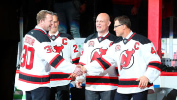 NEWARK, NJ - FEBRUARY 24: Former New Jersey Devil Martin Brodeur and Scott Niedermayer shaker hands during Patrik Elias Jersey Retirement Night prior to the National Hockey League Game between the New Jersey Devils and the New York Islanders on February 24, 2018, at the Prudential Center in Newark, NJ. (Photo by Rich Graessle/Icon Sportswire via Getty Images)