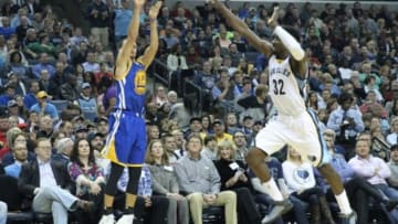 Mar 27, 2015; Memphis, TN, USA; Golden State Warriors guard Stephen Curry (30) shoots in the second half as Memphis Grizzlies forward Jeff Green (32) defends at FedExForum. Warriors defeated the Grizzlies 107-84. Mandatory Credit: Nelson Chenault-USA TODAY Sports