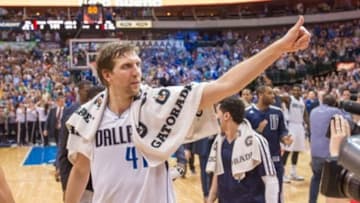 Apr 12, 2014; Dallas, TX, USA; Dallas Mavericks forward Dirk Nowitzki (41) and his team celebrate the win over the Phoenix Suns at the American Airlines Center. The Mavericks defeated the Suns 101-98 and clinched a spot in the NBA playoffs. Mandatory Credit: Jerome Miron-USA TODAY Sports