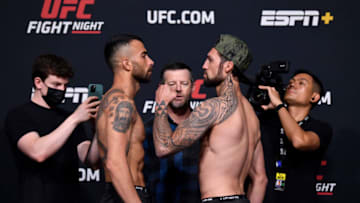 LAS VEGAS, NEVADA - JUNE 04: (L-R) Opponents Makwan Amirkhani of Finland and Kamuela Kirk face off during the UFC Fight Night weigh-in at UFC APEX on June 04, 2021 in Las Vegas, Nevada. (Photo by Jeff Bottari/Zuffa LLC via Getty Images)