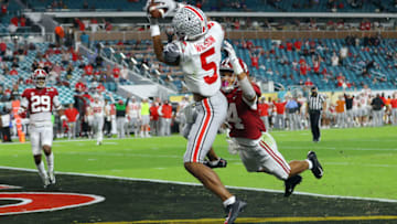 MIAMI GARDENS, FLORIDA - JANUARY 11: Garrett Wilson #5 of the Ohio State Buckeyes makes a 20 yard reception for a touchdown ahead of Brian Branch #14 of the Alabama Crimson Tide during the third quarter of the College Football Playoff National Championship game at Hard Rock Stadium on January 11, 2021 in Miami Gardens, Florida. (Photo by Kevin C. Cox/Getty Images)
