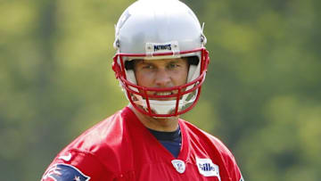 May 26, 2016; Foxborough, MA, USA; New England Patriots quarterback Tom Brady (12) looks on during OTA