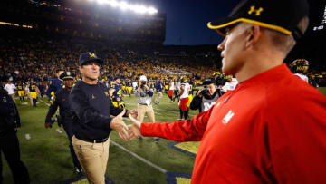 ANN ARBOR, MI - NOVEMBER 05: Head coach Jim Harbaugh of the Michigan Wolverines shakes hands with head coach D.J. Durkin of the Maryland Terrapins on November 5, 2016 at Michigan Stadium in Ann Arbor, Michigan. Michigan won the game 59-3. (Photo by Gregory Shamus/Getty Images)