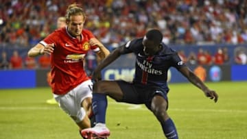 Jul 29, 2015; Chicago, IL, USA; Paris Saint-Germain forward Jean-Kevin Augustin (29) kicks the ball against Manchester United midfielder Daley Blind (17) during the first half at Soldier Field. Mandatory Credit: Mike DiNovo-USA TODAY Sports