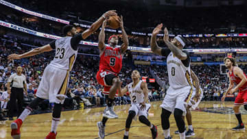 NEW ORLEANS, LA - APRIL 02: Chicago Bulls guard Rajon Rondo (9) has a shot blocked by New Orleans Pelicans forward Anthony Davis (23) during the game between the New Orleans Pelicans and the against the Chicago Bulls on April 2, 2017, at Smoothie King Center in New Orleans, LA. Bull won 117-110. (Photo by Stephen Lew/Icon Sportswire via Getty Images)