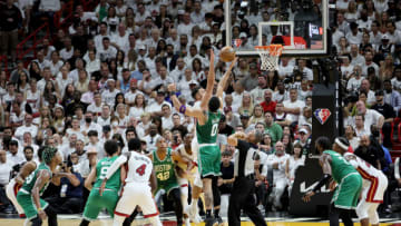 Max Strus #31 of the Miami Heat and Jayson Tatum #0 of the Boston Celtics look for the rebound (Photo by Andy Lyons/Getty Images)