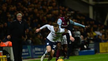 PRESTON, ENGLAND - NOVEMBER 01: Tom Barkhuizen of Preston North End and Albert Adomah of Aston Villa in action during the Sky Bet Championship match between Preston North End and Aston Villa at Deepdale on November 1, 2017 in Preston, England. (Photo by Nathan Stirk/Getty Images)