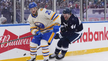 Mar 13, 2022; Hamilton, Ontario, CAN; Buffalo Sabres forward Vinnie Hinostroza (29) skates against Toronto Maple Leafs defenseman Morgan Rielly (44) during the first period in the 2022 Heritage Classic ice hockey game at Tim Hortons Field. Mandatory Credit: John E. Sokolowski-USA TODAY Sports