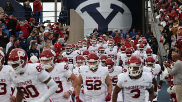 Nov 18, 2023; Provo, Utah, USA; The Oklahoma Sooners enter the field before the game against the Brigham Young Cougars at LaVell Edwards Stadium. Mandatory Credit: Rob Gray-USA TODAY Sports