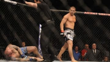 Apr 19, 2014; Orlando, FL, USA; Caio Magalhaes, red gloves, leaves opponent, Luke Zachrich, devastated in their middleweight fight during UFC on FOX 11 at Amway Center. Mandatory Credit: David Manning-USA TODAY Sports