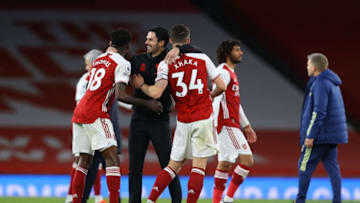 Arsenal's Spanish manager Mikel Arteta (C) celebrates with his players at the final whistle during the English Premier League football match between Arsenal and Tottenham Hotspur at the Emirates Stadium in London on March 14, 2021. - Arsenal won the game 2-1. - RESTRICTED TO EDITORIAL USE. No use with unauthorized audio, video, data, fixture lists, club/league logos or 'live' services. Online in-match use limited to 120 images. An additional 40 images may be used in extra time. No video emulation. Social media in-match use limited to 120 images. An additional 40 images may be used in extra time. No use in betting publications, games or single club/league/player publications. (Photo by Julian Finney / POOL / AFP) / RESTRICTED TO EDITORIAL USE. No use with unauthorized audio, video, data, fixture lists, club/league logos or 'live' services. Online in-match use limited to 120 images. An additional 40 images may be used in extra time. No video emulation. Social media in-match use limited to 120 images. An additional 40 images may be used in extra time. No use in betting publications, games or single club/league/player publications. / RESTRICTED TO EDITORIAL USE. No use with unauthorized audio, video, data, fixture lists, club/league logos or 'live' services. Online in-match use limited to 120 images. An additional 40 images may be used in extra time. No video emulation. Social media in-match use limited to 120 images. An additional 40 images may be used in extra time. No use in betting publications, games or single club/league/player publications. (Photo by JULIAN FINNEY/POOL/AFP via Getty Images)