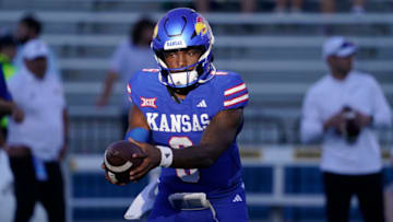LAWRENCE, KANSAS - SEPTEMBER 1: Jalon Daniels #6 of the Kansas Jayhawks warms up prior to a game against the Missouri State Bears at David Booth Kansas Memorial Stadium on September 1, 2023 in Lawrence, Kansas. (Photo by Ed Zurga/Getty Images)