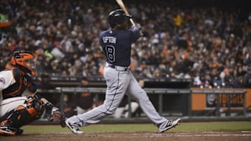 May 9, 2013; San Francisco, CA, USA; Atlanta Braves left fielder Justin Upton (8) hits a triple during the fifth inning against the San Francisco Giants at AT