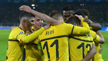 DORTMUND, GERMANY - OCTOBER 24: Raphael Guerreiro of Borussia Dortmund celebrates after scoring his team`s second goal with team mates during the UEFA Champions League Group A match between Borussia Dortmund and Club Atletico de Madrid at Signal Iduna Park on October 24, 2018 in Dortmund, Germany. (Photo by TF-Images/Getty Images)