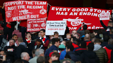 LONDON, ENGLAND - APRIL 30: Arsenal supporters hold protest banners during the Barclays Premier League match between Arsenal and Norwich City at The Emirates Stadium on April 30, 2016 in London, England (Photo by Paul Gilham/Getty Images)