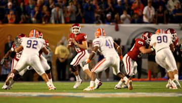 MIAMI - JANUARY 08: Sam Bradford #14 of the Oklahoma Sooners looks to pass against the Florida Gators during the FedEx BCS National Championship game at Dolphin Stadium on January 8, 2009 in Miami, Florida. (Photo by Doug Benc/Getty Images)