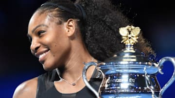 Serena Williams of the US holds up the trophy following her victory over Venus Williams of the US in the women's singles final on day 13 of the Australian Open tennis tournament in Melbourne on January 28, 2017. / AFP / PAUL CROCK / IMAGE RESTRICTED TO EDITORIAL USE - STRICTLY NO COMMERCIAL USE (Photo credit should read PAUL CROCK/AFP/Getty Images)