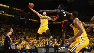 OAKLAND, CA - APRIL 15: Stephen Curry #30 of the Golden State Warriors shoots the ball against the LA Clippers during Game Two of Round One of the 2019 NBA Playoffs on April 15, 2019 at ORACLE Arena in Oakland, California. NOTE TO USER: User expressly acknowledges and agrees that, by downloading and or using this photograph, user is consenting to the terms and conditions of Getty Images License Agreement. Mandatory Copyright Notice: Copyright 2019 NBAE (Photo by Noah Graham/NBAE via Getty Images)