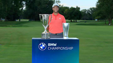 OLYMPIA FIELDS, ILLINOIS - AUGUST 30: Jon Rahm of Spain celebrates next to the J.D. Wadley trophy and the BMW trophy after winning on the first sudden-death playoff hole against Dustin Johnson (not pictured) during the final round of the BMW Championship on the North Course at Olympia Fields Country Club on August 30, 2020 in Olympia Fields, Illinois. (Photo by Andy Lyons/Getty Images)