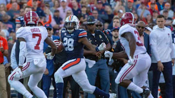 Auburn football running back JaTarvious Whitlow (28) runs the ball during the first quarter.Iron Bowl 2019