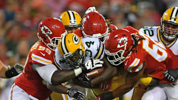 KANSAS CITY, MO - SEPTEMBER 01: Defenders Terrance Smith #62 and Rakeem Nunez-Roches #99 of the Kansas City Chiefs tackle running back Brandon Burks #34 of the Green Bay Packers during the first half on September 1, 2016 at Arrowhead Stadium in Kansas City, Missouri. (Photo by Peter G. Aiken/Getty Images)