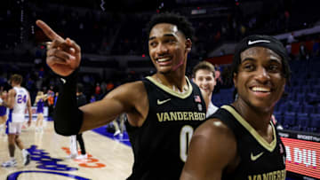 GAINESVILLE, FLORIDA - FEBRUARY 11: Tyrin Lawrence #0 of the Vanderbilt Commodores and Ezra Manjon #5 of the Vanderbilt Commodores celebrate after defeating the Florida Gators 88-80 in a game at the Stephen C. O'Connell Center on February 11, 2023 in Gainesville, Florida. (Photo by James Gilbert/Getty Images)