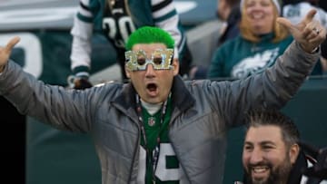 Jan 1, 2017; Philadelphia, PA, USA; A Philadelphia Eagles fan wearing new years glasses cheers on against the Dallas Cowboys at Lincoln Financial Field. The Philadelphia Eagles won 27-13. Mandatory Credit: Bill Streicher-USA TODAY Sports