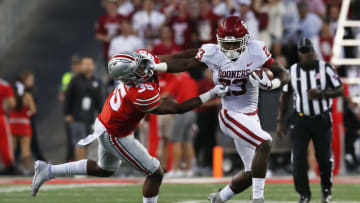 COLUMBUS, OH - SEPTEMBER 09: Abdul Adams #23 of the Oklahoma Sooners stiff arms Chris Worley #35 of the Ohio State Buckeyes during the first half of their game at Ohio Stadium on September 9, 2017 in Columbus, Ohio. (Photo by Gregory Shamus/Getty Images)