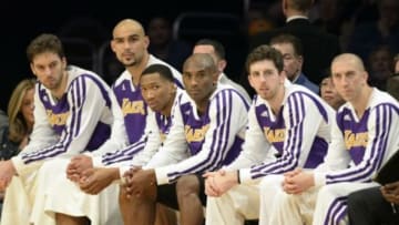 Dec 8, 2013; Los Angeles, CA, USA; Los Angeles Lakers shooting guard Kobe Bryant (middle) on the bench with his teammates during the first half against the Toronto Raptors at Staples Center. Mandatory Credit: Richard Mackson-USA TODAY Sports