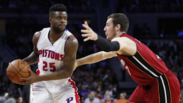 Apr 12, 2016; Auburn Hills, MI, USA; Detroit Pistons forward Reggie Bullock (25) is defended by Miami Heat guard Goran Dragic (7) during the fourth quarter at The Palace of Auburn Hills. Heat win 99-93. Mandatory Credit: Raj Mehta-USA TODAY Sports