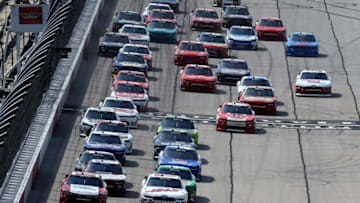 DARLINGTON, SC - SEPTEMBER 02: Denny Hamlin, driver of the #18 Sport Clips Toyota, and Cole Custer, driver of the #00 Haas Automation Ford, lead the field into turn one for a restart during the NASCAR XFINITY Series Sports Clips Haircuts VFW 200 at Darlington Raceway on September 2, 2017 in Darlington, South Carolina. (Photo by Jerry Markland/Getty Images)