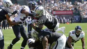 Sep 20, 2015; Oakland, CA, USA; Oakland Raiders running back Latavius Murray (28) scores on a one-yard touchdown run in the second quarter against the Baltimore Ravens as at O.co Coliseum. Mandatory Credit: Kirby Lee-USA TODAY Sports