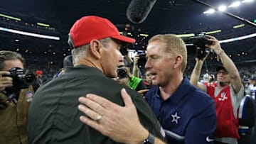 Dec 18, 2016; Arlington, TX, USA; Dallas Cowboys head coach Jason Garrett meets with Tampa Bay Buccaneers head coach Dirk Koetter after the game at AT&T Stadium. Dallas beat Tampa 26-20. Mandatory Credit: Matthew Emmons-USA TODAY Sports