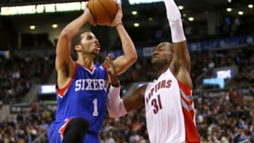 Apr 9, 2014; Toronto, Ontario, CAN; Philadelphia 76ers guard Michael Carter-Williams (1) goes to make a basket as Toronto Raptors guard Terrence Ross (31) defends at the Air Canada Centre. Toronto defeated Philadelphia 125-114. Mandatory Credit: John E. Sokolowski-USA TODAY Sports
