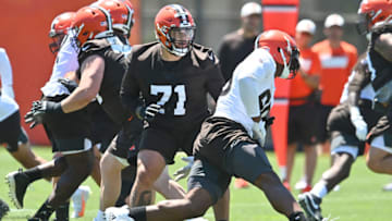 Jun 16, 2021; Berea, Ohio, USA; Cleveland Browns offensive tackle Jedrick Wills (71) defends against defensive end Myles Garrett (95) during minicamp at the Cleveland Browns training facility. Mandatory Credit: Ken Blaze-USA TODAY Sports