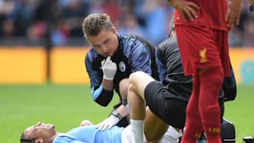 LONDON, ENGLAND - AUGUST 04: Leroy Sane of Manchester City receives medical attention during the FA Community Shield match between Liverpool and Manchester City at Wembley Stadium on August 04, 2019 in London, England. (Photo by Michael Regan/Getty Images)