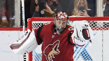 GLENDALE, AZ - FEBRUARY 26: Darcy Kuemper #35 of the Arizona Coyotes makes a glove save against the Florida Panthers at Gila River Arena on February 26, 2019 in Glendale, Arizona. (Photo by Norm Hall/NHLI via Getty Images)
