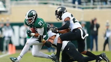EAST LANSING, MI - OCTOBER 27: Cam Chambers #21 of the Michigan State Spartans makes a catch for a first down and tackled by Markus Bailey #21 of the Purdue Boilermakers at Spartan Stadium on October 27, 2018 in East Lansing, Michigan. (Photo by Rey Del Rio/Getty Images)