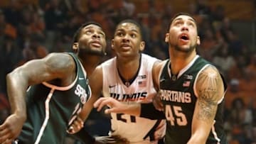 Feb 22, 2015; Champaign, IL, USA; Michigan State Spartans forward Branden Dawson (22) and guard Denzel Valentine (45) box out Illinois Fighting Illini guard Malcolm Hill (21) at State Farm Center. Mandatory Credit: Mike Granse-USA TODAY Sports