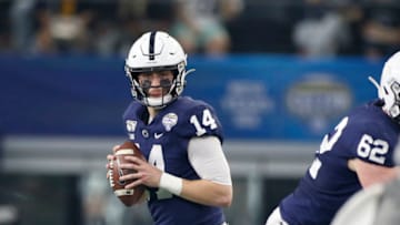 Dec 28, 2019; Arlington, Texas, USA; Penn State Nittany Lions quarterback Sean Clifford (14) looks to pass in the second quarter against the Memphis Tigers at AT&T Stadium. Mandatory Credit: Tim Heitman-USA TODAY Sports