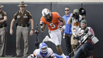 STILLWATER, OK - SEPTEMBER 15: Running back Justice Hill #5 of the Oklahoma State Cowboys struggles to stay in bounds on a break away run against the Boise State Broncos at Boone Pickens Stadium on September 15, 2018 in Stillwater, Oklahoma. The Cowboys defeated the Broncos 44-21. (Photo by Brett Deering/Getty Images)