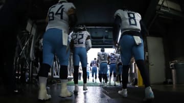 EAST RUTHERFORD, NEW JERSEY - DECEMBER 16: Josh Kline #64 and Marcus Mariota #8 of the Tennessee Titans join their team entering the field against the New York Giants during their game at MetLife Stadium on December 16, 2018 in East Rutherford, New Jersey. (Photo by Al Bello/Getty Images)