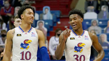 Dec 11, 2020; Lawrence, Kansas, USA; Kansas Jayhawks forward Jalen Wilson (10) laughs with guard Ochai Agbaji (30) in a timeout during the first half against the Nebraska-Omaha Mavericks at Allen Fieldhouse. Mandatory Credit: Denny Medley-USA TODAY Sports