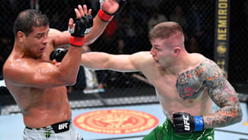 LAS VEGAS, NEVADA - OCTOBER 23: (R-L) Marvin Vettori of Italy punches Paulo Costa of Brazil in a light heavyweight fight during the UFC Fight Night event at UFC APEX on October 23, 2021 in Las Vegas, Nevada. (Photo by Jeff Bottari/Zuffa LLC)